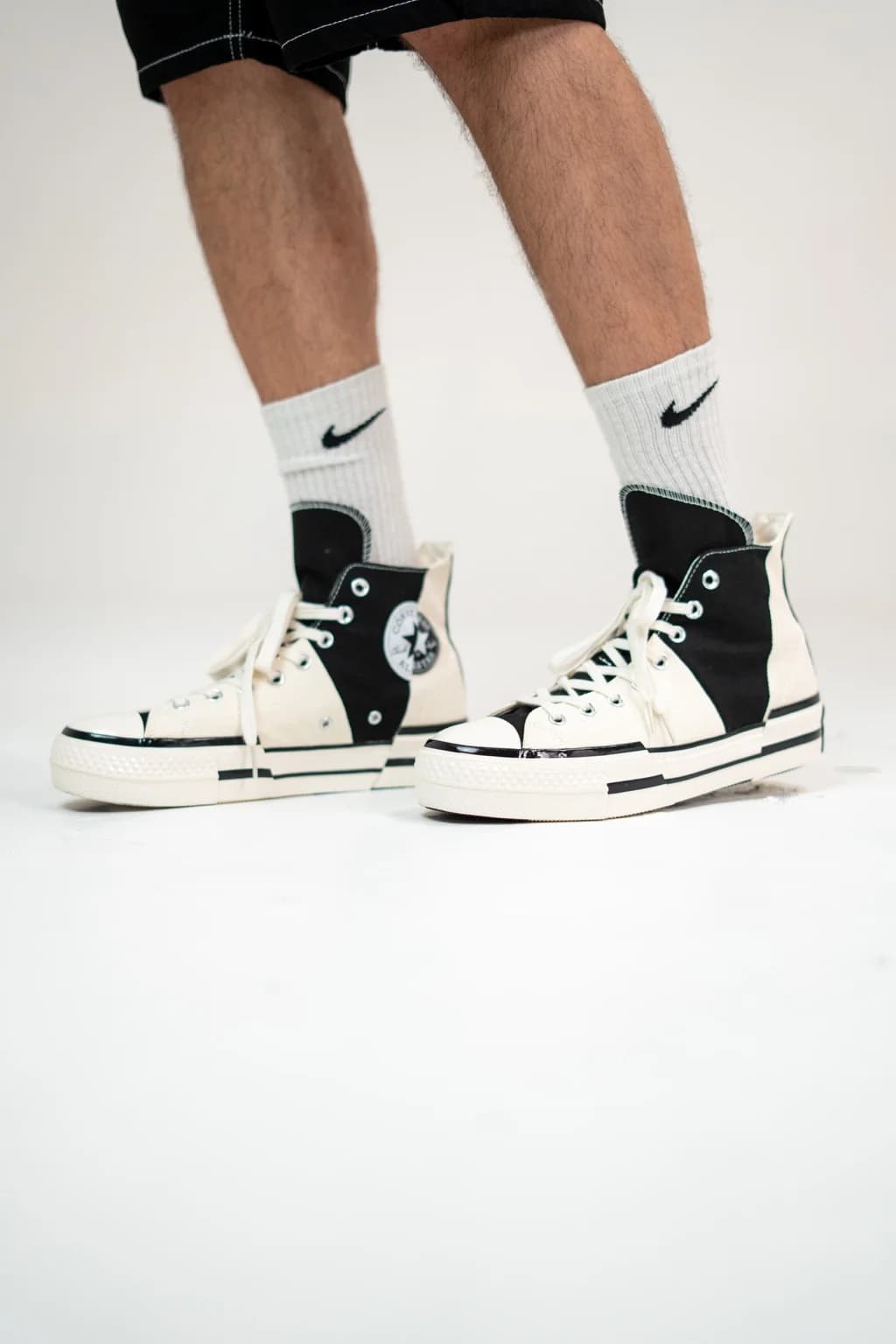 کتانی Converse High Top Black White On Feet Left View